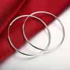 Round Earring with Smooth Surface and Silver Trim