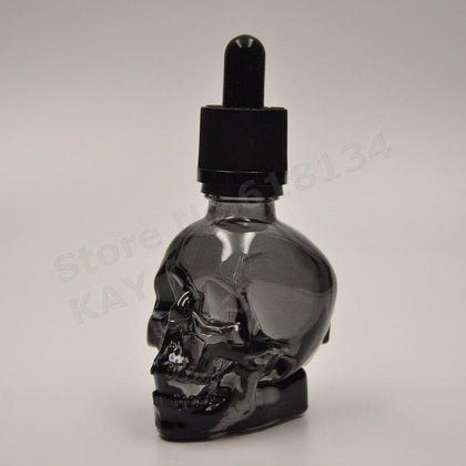 30ml skull bottle 30ml frosted black skull shape glass dropper bottle with child proof